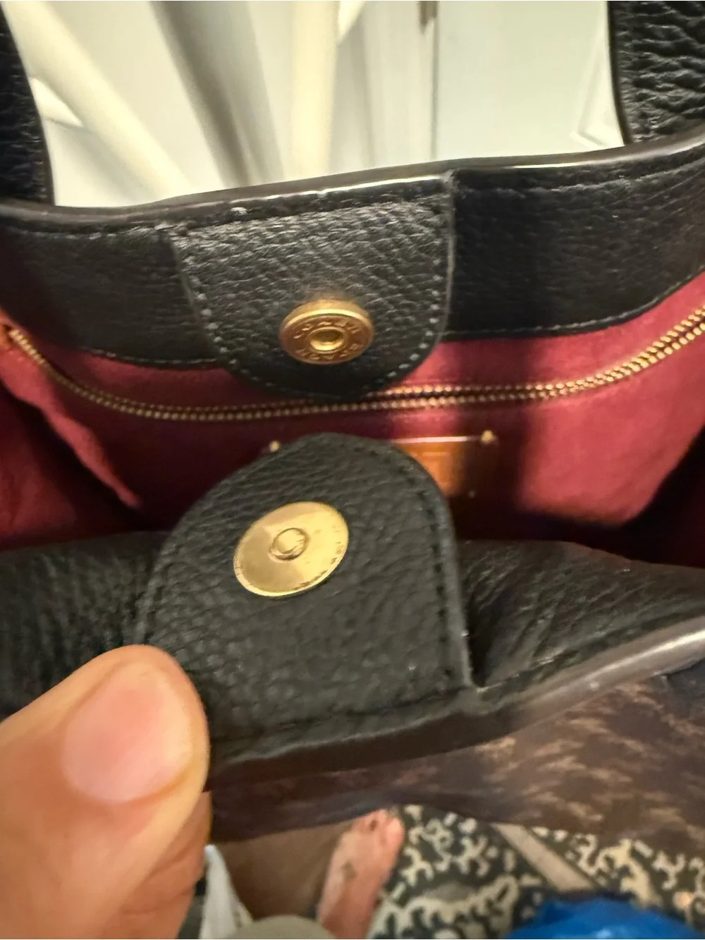 This is a Coach Field Tote in Truffle Black with a horse and carriage print